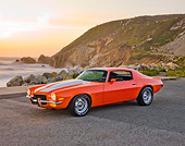 CAM 04 RK0138 01
1973 Chevrolet Camaro Orange And White Stripes 3/4 Front View On Pavement By Sand Dune