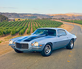 CAM 04 RK0160 01
1972 Chevrolet Camaro RS Blue With Black Stripes 3/4 Front View On Road By Vineyards