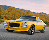 CAM 04 RK0254 01
1971 Chevrolet Camaro High Velocity Yellow With Charcoal Pearl Stripes 3/4 Front View On Pavement By Autumn Trees And Vineyard