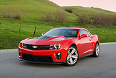 CAM 04 RK0260 01
2013 Chevrolet Camaro ZL1 Red 3/4 Front View On Pavement By Grassy Hills