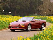 CAM 04 RK0001 16
1995 Chevrolet Camaro Convertible Burgundy 3/4 Front View By Yellow Flower Field