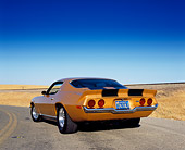 CAM 04 RK0073 02
1973 Chevrolet Camaro Gold Black Stripe Low 3/4 Rear View On Road