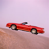 CAM 06 RK0004 08
1988 Chevrolet Camaro IROC-Z Convertible Red Slanted 3/4 Rear View On Pavement Hill