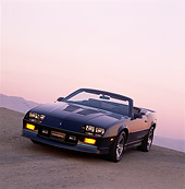 CAM 06 RK0017 07
1989 Chevrolet Camaro Iroc-Z Convertible Black Slanted 3/4 Front View At Dusk