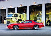 CAM 06 RK0025 01
1986 Chevrolet Camaro IROC-Z Red 3/4 Front View At Fire Station