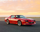CAM 06 RK0026 01
1986 Chevrolet Camaro IROC-Z Red 3/4 Front View At Dusk