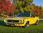 CAM 07 RK0136 01
1969 Chevrolet Camaro RS/SS Daytona Yellow 3/4 Front View On Grass By Autumn Trees
