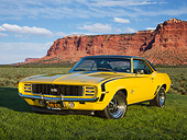CAM 07 RK0137 01
1969 Chevrolet Camaro RS/SS Daytona Yellow 3/4 Front View On Grass By Desert