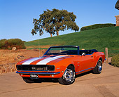 CAM 07 RK0016 05
1968 Chevrolet Camaro RS/SS Convertible Orange White Stripe 3/4 Front View On Pavement By Grass Hill