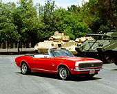 CAM 07 RK0041 02
1968 Chevrolet Camaro RS/SS Convertible Red And White 3/4 Front View On Pavement By Tanks
