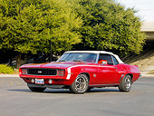 CAM 07 RK0094 01
1969 Chevrolet Camaro RS/SS Convertible Red And White 3/4 Front View On Pavement By Trees