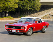 CAM 07 RK0095 01
1969 Chevrolet Camaro RS/SS Convertible Red And White 3/4 Front View On Pavement By Trees