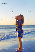 CHD 04 LS0001 01
Girl On Beach Holding Conch Shell To Her Ear Florida