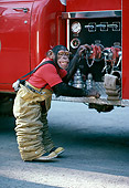 CHI 02 RK0076 01
Chimpanzee Wearing Fireman Outfit Standing By Water Pumps