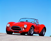 COB 01 RK0007 05
1965 Shelby Cobra 427 Convertible Red Low 3/4 Front View On Pavement Blue Sky