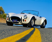 COB 01 RK0054 01
1966 Cobra 427 Convertible Low 3/4 Front View On Pavement Blue Sky