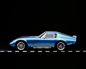 COB 01 RK0116 04
1965 Shelby, Cobra, Replica, Daytona Coupe, Electric Blue Viper Blue, Factory 5 Racing Kit Profile View On Pavement By Trees