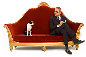 DOG 02 JE0052 01
Boston Terrier Sitting On Red Sofa With Psychiatrist On White Seamless