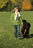 DOG 07 LS0001 01
Australian Labradoodle Walking On Leash With Girl