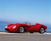 FRR 03 RK0011 01
1958 Ferrari 250 TR Rebody Red 3/4 Front View On Road Ocean Blue Sky