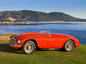 FRR 03 RK0120 01
1950 Ferrari 166 MM Touring  Barchetta Red Front 3/4 View On Grass By Water Mountains Sky