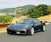 FRR 04 RK0378 01
2005 Ferrari F430 Grigio Silverstone 3/4 Front View On Pavement By Hills And Trees