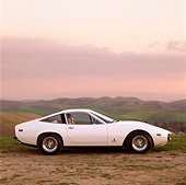 FRR 04 RK0075 12
1971 Ferrari 365 GTC/4 White On Dirt By Grass Hills In Background
