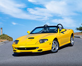 FRR 04 RK0242 07
2001 Ferrari Barchetta Yellow 3/4 Front View On Pavement Hill Blue Sky