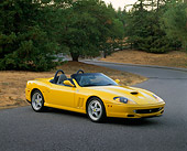 FRR 04 RK0250 04
2001 Ferrari Barchetta Yellow 3/4 Side View On Pavement By Trees