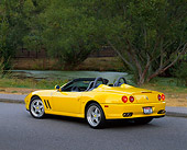 FRR 04 RK0252 04
2001 Ferrari Barchetta Yellow 3/4 Rear View On Pavement By Water And Trees