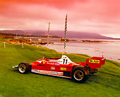 FRR 04 RK0352 05
1977 Ferrari 312T2 Red 3/4 Rear View On Grass By Flags And Water