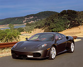 FRR 04 RK0377 01
2005 Ferrari F430 Grigio Silverstone 3/4 Front View On Pavement By Hills And Trees