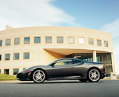 FRR 04 RK0385 11
2005 Ferrari F430 Grigio Silverstone Low Profile Shot On Pavement By Building