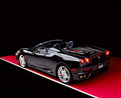 FRR 04 RK0405 01
2005 Ferrari F430 Spider Black 3/4 Rear View On Red Floor Studio