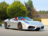 FRR 08 RK0126 01
2009 Ferrari F430 16M Scuderia Spider Silver 3/4 Front View On Pavement By Trees