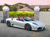 FRR 08 RK0131 01
2009 Ferrari F430 16M Scuderia Spider Silver 3/4 Front View On Pavement By Vineyard