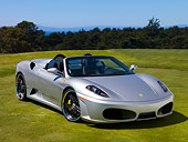 FRR 08 RK0120 01
2007 Ferrari F430 Spider Silver Front 3/4 View On Grass By Trees Sky