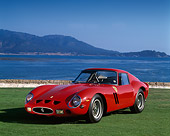 FRR 09 RK0035 08
1962 Ferrari GTO Red 3/4 Front View On Grass By Water Blue Sky