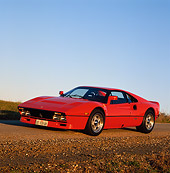 FRR 14 RK0020 04
Red Ferrari 328 3/4 Front View On Dirt Road By Grass Blue Sky