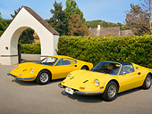 FRR 17 RK0008 01
1969 Ferrari Dino 246 GT Coupe Yellow And 1973 Ferrari Dino 246 GTS Spyder Yellow 3/4 Front View On Pavement By Shrubs