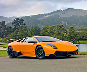 LAM 01 BK0011 01
2010 Lamborghini Murci�lago LP670-4 SV Orange 3/4 Front View On Pavement By Hills
