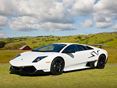 LAM 01 BK0020 01
2010 Lamborghini Murcielago LP 670-4 SuperVeloce White 3/4 Front View On Grass By Hills