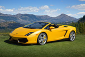 LAM 01 BK0040 01
2012 Lamborghini Gallardo LP 550-2 Spyder Yellow 3/4 Front View On Grass By Mountains
