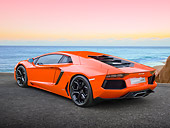 LAM 01 RK0761 01
2012 Lamborghini Aventador Orange 3/4 Rear View On Pavement By Beach At Dusk