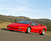 LAM 01 RK0059 01
Lamborghini Diablo 3/4 Front View On Pavement By Mountains Blue Sky Slanted