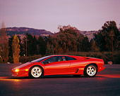 LAM 01 RK0063 02
Lamborghini Diablo Red Profile View On Pavement At Night By Trees