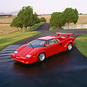 LAM 01 RK0164 03
1989 Lamborghini Countach Anniversary Edition Red Overhead 3/4 Front View On Pavement