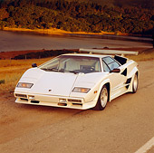 LAM 01 RK0185 02
Lamborghini Countach White 3/4 Front View On Pavement By Water Trees At Dusk