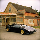 LAM 01 RK0214 01
Lamborghini Countach Black 3/4 Front View On Pavement By Old House