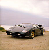 LAM 01 RK0226 02
Lamborghini Countach Black 3/4 Front View On Sand By Water Gray Sky